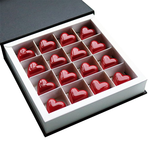 Valentine's Red Heart Chocolates in Open Chocolate Gift Box Angled