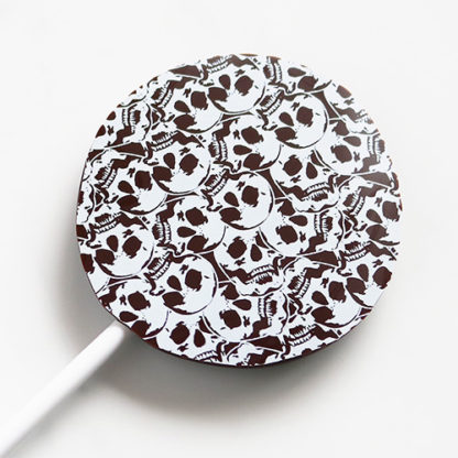 Dark Chocolate Halloween Lollipop with Skull Pattern Overhead Close Up