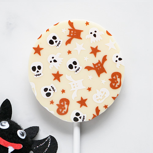 White Chocolate Halloween Lollipop with Seasonal Pattern Peeking Bat Overhead